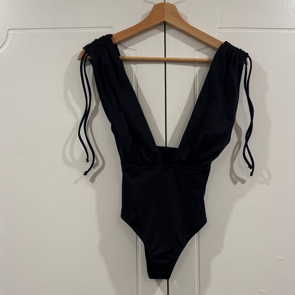 ASOS Black women’s deep cut swim suit with tie details